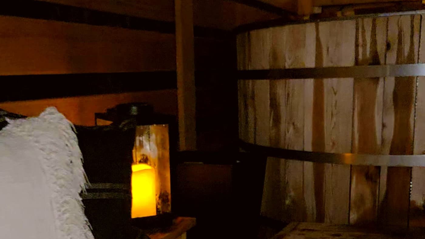 Cedar hot tub with wood-fire stove chimney